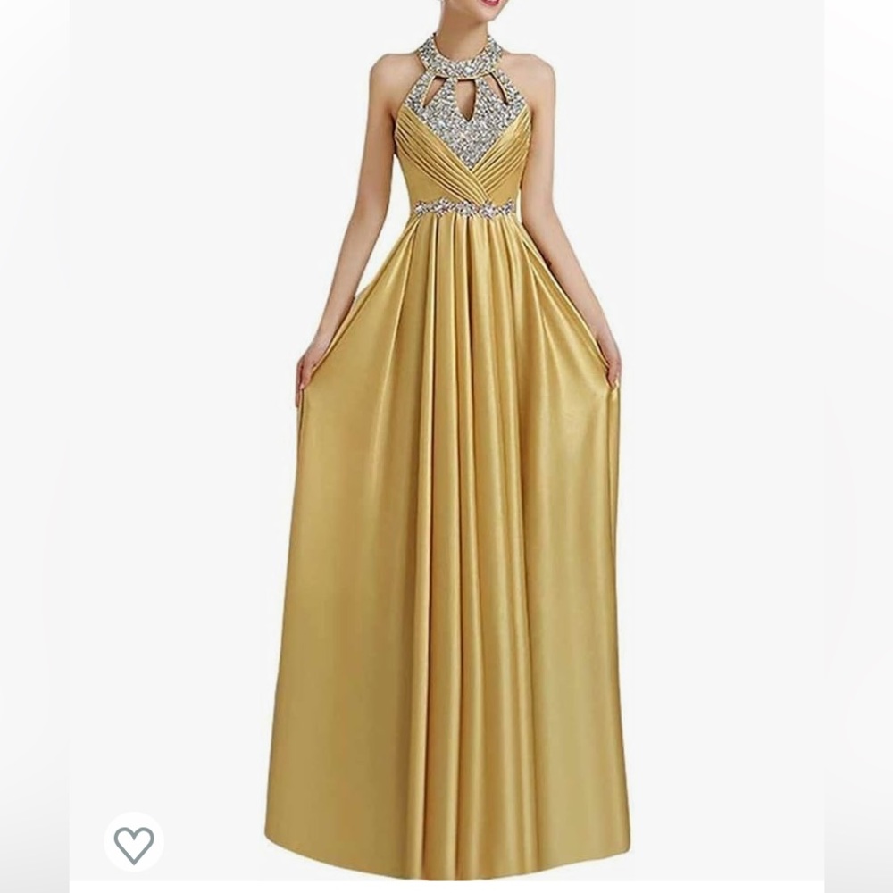 Yellow gold open back formal dress with jewels.